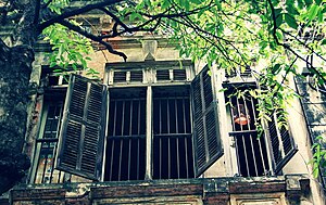 English: Open window of an old house, Nguyen S...