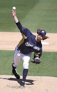 A baseball player in navy and white