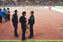 Officers of the Royal Malaysia Police on duty at the men's football final. Malaysian Police CID 2017 SEA Games Football final.jpg