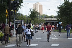 People walking and biking on Franklin Avenue in 2016. Open Streets Franklin Avenue 2016 (29063302551).jpg