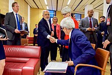 Secretary Kerry shakes hands with minister Zarif.jpg