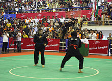 Amelia Roring of Indonesia competing against Siti Rahmah Mohd Nasir of Malaysia in the women's Pencak Silat class E 65 - 70 kg final. Women Pencak Silat Match Indonesia vs Malaysia.jpg