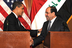 President Barack Obama shakes hands with Iraqi...