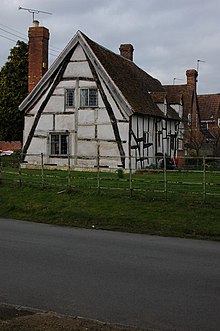 A half timbered house in Worcestershire framed with a full cruck Cruck cottage in Wick - geograph.org.uk - 742651.jpg