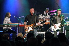 Clarke (right) performing with Kast off Kinks in 2009