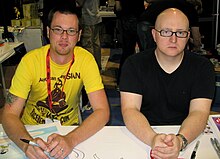 Mike Krahulik (left) and Jerry Holkins (right) stepped in to donate $10,000 to charity in Thompson's stead. Krahulik Holkins, Comicon 2009.jpg