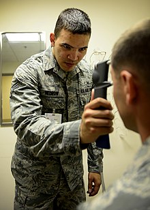 A technician at Aviano Air Base Optometry Clinic measures the intraocular pressure of a patient with a handheld tonometer, July 7, 2015. Optometry helps keep focus on the mission 150707-F-IT851-012.jpg
