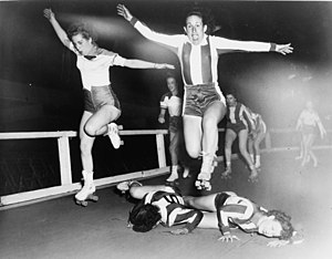 Two women's league roller derby skaters leap o...