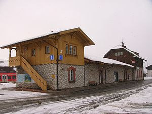 Two two-story stone buildings joined by a single-story connection