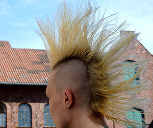Young girl with blond mohawk in Germany.