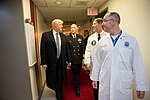 President Donald J. Trump talks with, from left to right, with Capt. Mark Kobelja, Director of Walter Reed National Military Medical Center; Dr. Ronny Jackson, Physician to the President; and Dr. James Jones, physical to the President and Medical Director of the Medical Evaluation and Treatment Unit, Friday January 12, 2018, in Bethesda, MD, following the President's annual physical at the medical facility.