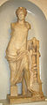 Roman sculpture of Apollo leaning on the Delphic tripod. CE 2nd century