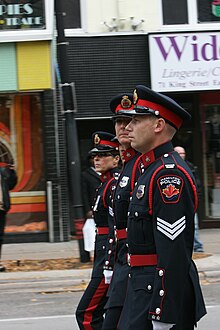 Members of the Hamilton Police Honour Guard march in the funeral of honourary police chief Lincoln Alexander. Hamilton Police Service in Hon. Lincoln Alexander Funeral Procession (8127323648).jpg