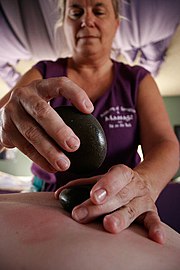 A hot stone massage being performed in Oxnard, California.