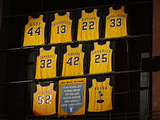 Lakers retired jerseys hanging inside the Crypto.com Arena in 2013. Since this picture was taken, the Lakers have modified the banners to more accurately reflect the jersey style each player wore. Lakers vs Nuggets 2013-01-06 (15).jpg