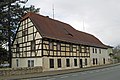 Bauernhaus und Erweiterungsbau sowie Einfriedungsmauer