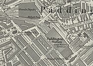 A map showing Paddington mainline station aligned diagonally north-west to south-east amongst streets of houses. Smaller, Metropolitan Railway stations are to the north and south and a goods station is located to the north of all of these.