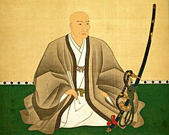 Toyokuni Yamana (1548–1626), samuraj i dowódca z okresu Sengoku trzymający tachi; widoczne ozdobne rapcie