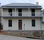 Type of site: House. These double-storeyed semi-detached houses with their Victorian and Georgian features were erected shortly after the turn of the century. These in Donkin Street, situated opposite the Donkin Reserve, form part of a unique row of terrace houses in the Vict