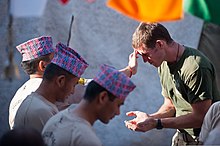 A British Army soldier with Nepalese Gurkha soldiers A Nepalese soldier, back left, with the Royal Gurkha Rifles (RGR) regiment of the British army, Brigade of Gurkhas blesses a British soldier during the Nepalese festival of Dashain in Lashkar Gah district 110924-N-TH989-244.jpg