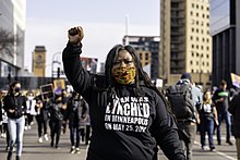Nekima Levy Armstrong protesting against the murder of George Floyd Attorney and civil rights activist, Nekima Levy Armstrong, leads a silent march for justice for George Floyd in downtown Minneapolis, Minnesota on the day before the beginning of the trial of Derek Chauvin (51013554148).jpg