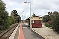 Southbound view from Platform 1, including waiting shelters, July 2018