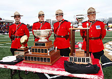 From left to right, The Ted Morris Trophy, Vanier Cup and Bruce Coulter Trophy at the 2009 Vanier Cup at PEPS Stadium in Quebec City. CIS Championship trophies.jpg