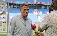 Phil Neville as England manager in a post match interview following a friendly against New Zealand in 2019. England Women 0 New Zealand Women 1 01 06 2019-1351 (47986530176).jpg