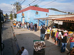 Shoppers waiting in line at a government-run MERCAL store Escasez en Venezuela, Mercal.JPG