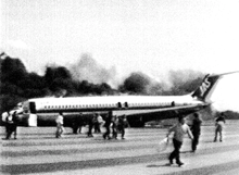 Flight 451 burning with emergency slides deployed Japan Air System Flight 451 after accident.png