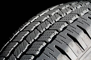 An automotive tire tread typically ranges from...