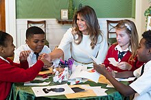 Melania working with children at a 2017 Christmas event; children's welfare was among the most important issues to Melania. White House Christmas (38121595104).jpg