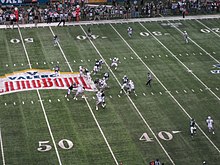Action during the 2011 Alamo Bowl, with the logo of the corporate sponsor, Valero, at mid-field 2011 Alamo Bowl Terrance Ganaway touchdown.jpg