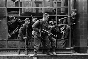 Members of the SS-Sondereinheit Dirlewanger during the Warsaw Uprising. The unit embodied some of the worst excesses of the Nazi regime. Bundesarchiv Bild 183-R97906 Warschauer Aufstand, Strassenkampf, SS.jpg