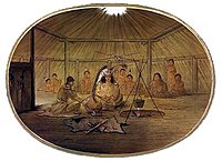 A feast inside a Mandan lodge, art by George Catlin, showing the four pillars supporting the roof and the smoke hole, ca. 1830