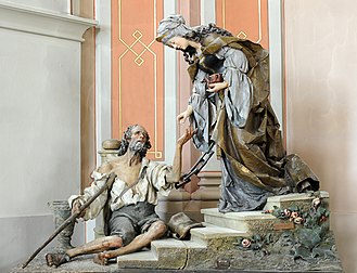 Élisabeth de Hongrie offrant nourriture à un pauvre, sculpture sur bois de Rudolf Moroder, polychromie de Christian Delago, en l'église d'Ortisei, dans le Trentin-Haut-Adige. (définition réelle 3 463 × 2 650)