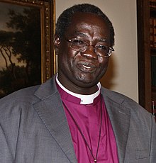 Foreign Office Minister Henry Bellingham meeting the Archbishop of Sudan, the Most Revd Daniel Deng and Archbishop of Canterbury, Dr Rowan Williams in London, 7 October 2010 (5059026425) (Daniel Deng Bul cropped).jpg