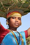 A Bondo woman walks to a weekly market in Chhattisgarh. The Bondo, among the Adivasi, or the indigenous peoples of India, speak a Munda language within the family of Austroasiatic languages.[6]