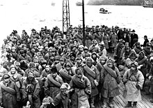 Japanese prisoners released from Soviet captivity in Siberia prepare to disembark from a ship docked at Maizuru, Japan, January 1946. Japanese Soldiers Returning from Siberia 1946.jpg