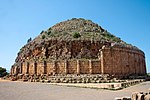 Ruins of an ancient mausoleum in a cylindrical shape