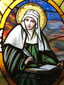 St Bridget of Sweden pictured with a halo. In Christian iconography, saints may also be depicted with wreaths, palm branches, and white lilies. St. Bridget of Sweden on a church window.jpg