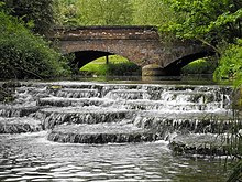A weir and mill that fall within Buckingham University's Hunter Street campus. The 'Flosh' and Lords Bridge, Buckingham - geograph.org.uk - 1316741.jpg