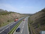 A two-lane dual carriageway in a cutting.