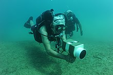 US Navy diver training in the use of a hand held sonar device US Navy 100708-N-4776G-203 Explosive Ordnance Disposal Technician 3rd Class Jonathan Sokol conducts training on a AN-PQS 2A hand held sonar.jpg
