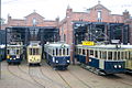 Drie als museumtram bewaarde wagens van de Blauwe Tram: de NZH A 327, NZH B 412 en NZH A 106. Er tussen staat de Gele Tram, motorwagen HTM 57. Opstelling ter gelegenheid van 'Retourtje Leiden' in de Remise Frans Halsstraat te Den Haag; 30 oktober 2011.