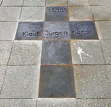 photograph of street paving slabs formed into a cross with the legend "22.9.81 Klaus Jürgen Rattay"