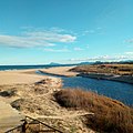 Gola del riu Vaca excavada amb maquinària pesant per permetre l'evacuació de cabal cap al Mediterrani. Orientació de la fotografia: Sud-est.