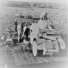 Italians in East Africa repairing an armoured car Italians repairing an amoured vehicle in East Africa.jpg