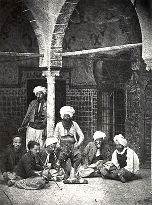 arab men smoking pipe and drinking turkish cof...