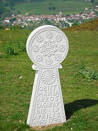 A reproduction of a Hilarri, a Basque gravestone, from 1736 with commonly found symbols. Translated from Latin, it reads, "Maria Arros Sagaray died on the 19th day of April, 1736". Obiit.JPG